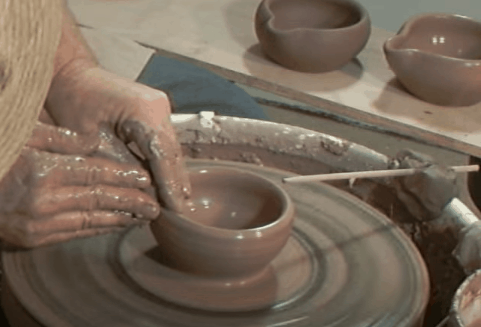 Throw clay mortar and pestles on a pottery wheel
